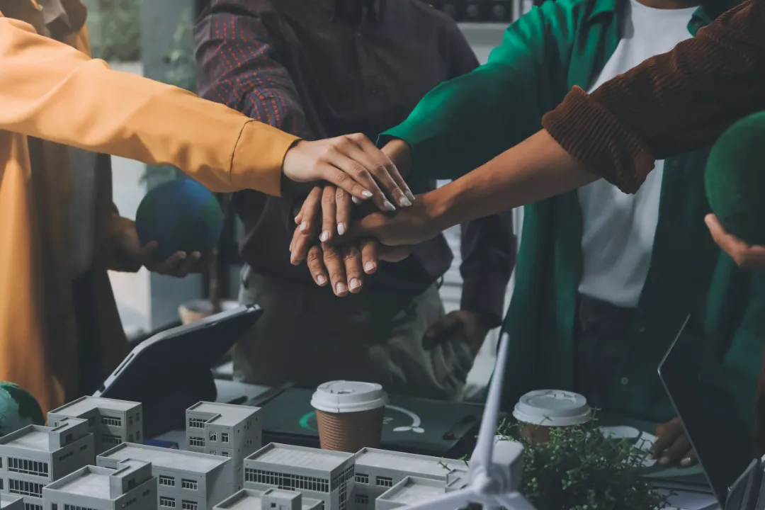 Asian business people team brainstorm meeting in green corporate